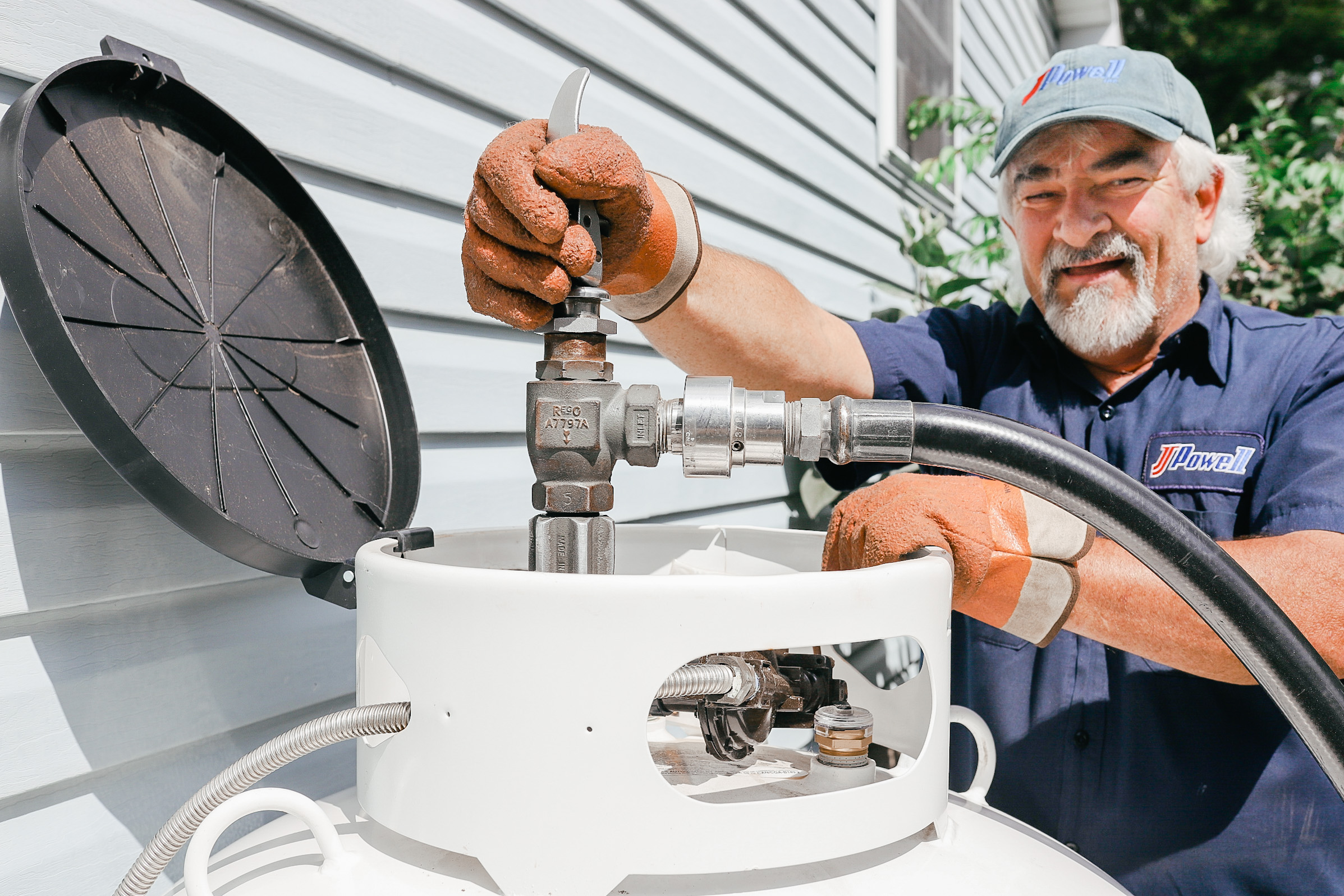 JJ Powell driver delivers propane to a Philipsburg, PA propane tank.
